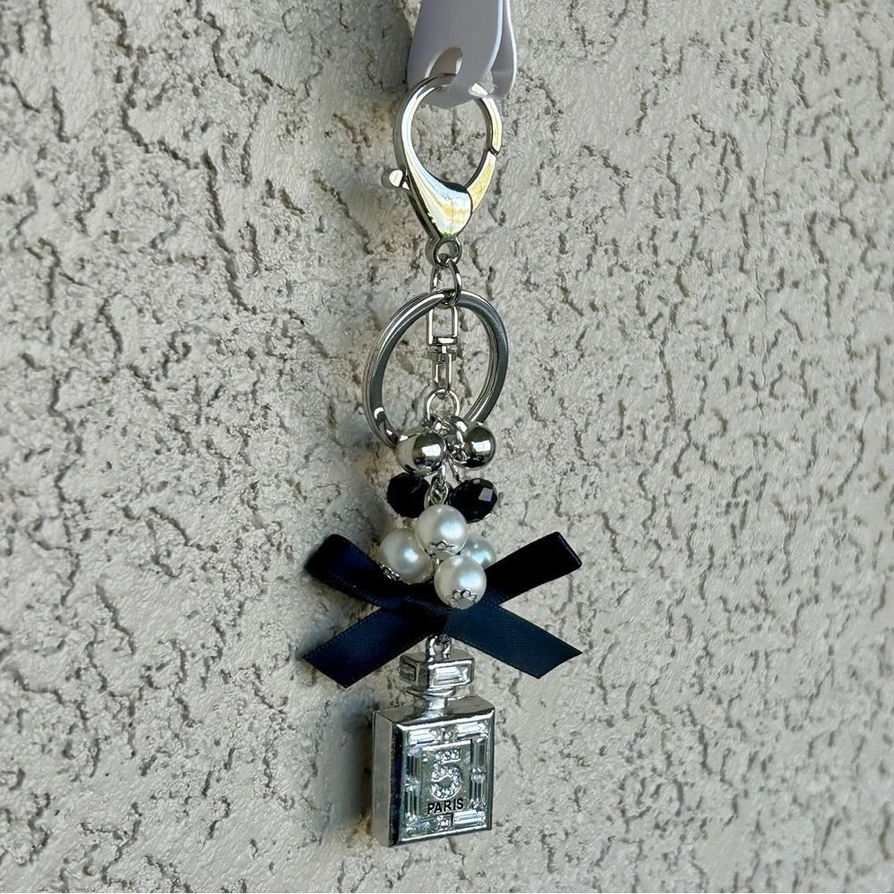 Luxe Silver Perfume Bottle Keychain/Bag Charm with Black Bow